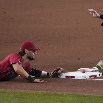 Arizona Diamondbacks shortstop Blaze Alexander (9) forces out San Diego Padres catcher Freddy Fermin (54) at third base during the eighth inning at Chase Field on Aug. 6.