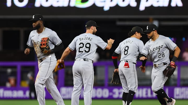 Jul 5, 2024; Miami, Florida, USA; Chicago White Sox center fielder Luis Robert Jr. (88), shortstop Paul DeJong (29), second baseman Nicky Lopez (8) and right fielder Tommy Pham (28) celebrate after the game against the Miami Marlins at loanDepot Park. Mandatory Credit: Sam Navarro-Imagn Images Jul 5, 2024; Miami, Florida, USA; Chicago White Sox center fielder Luis Robert Jr. (88), shortstop Paul DeJong (29), second baseman Nicky Lopez (8) and right fielder Tommy Pham (28) celebrate after the game against the Miami Marlins at loanDepot Park. Mandatory Credit: Sam Navarro-Imagn Images