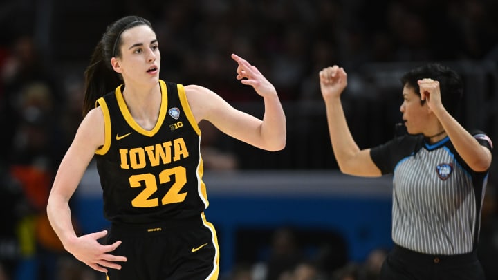 Iowa Hawkeyes guard Caitlin Clark reacts after making a shot during the National Championship against South Carolina