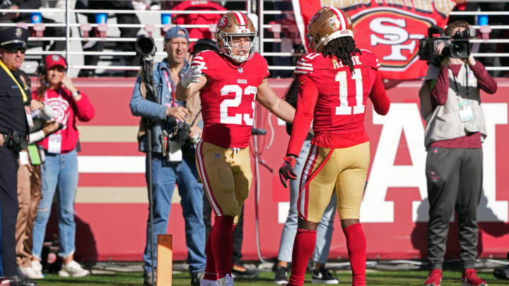 Nov 19, 2023; Santa Clara, California, USA; San Francisco 49ers running back Christian McCaffrey (23) celebrates with wide receiver Brandon Aiyuk (11) after scoring a touchdown against the Tampa Bay Buccaneers during the first quarter at Levi's Stadium. Mandatory Credit: Darren Yamashita-USA TODAY Sports