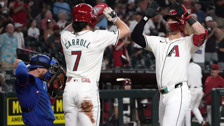 Sep 11, 2024; Phoenix, Arizona, USA; Arizona Diamondbacks outfielder Randal Grichuk (15) celebrates with Corbin Carroll (7) after hitting a two-run home run and 200th of his career against the Texas Rangers in the first inning at Chase Field. Mandatory Credit: Rick Scuteri-Imagn Images