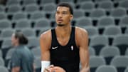 Oct 6, 2025; San Antonio, TX, USA; San Antonio Spurs forward-center Victor Wembanyama (1) warms up before a game against the Guangzhou Loong Lions at Frost Bank Center.