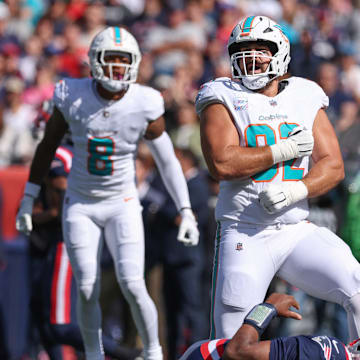 Miami Dolphins defensive tackle Zach Sieler (92) celebrates after a sack of New England Patriots quarterback Jacoby Brissett (7) during the first half at Gillette Stadium. 