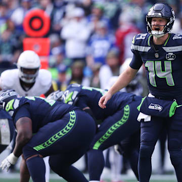 Nov 9, 2025; Seattle, Washington, USA; Seattle Seahawks quarterback Sam Darnold (14) calls a play during the first quarter against the Arizona Cardinals at Lumen Field. Mandatory Credit: Kevin Ng-Imagn Images