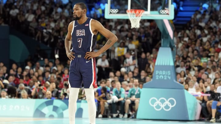 Aug 6, 2024; Paris, France; United States guard Kevin Durant (7) looks on in the first half against Brazil in a men’s basketball quarterfinal game during the Paris 2024 Olympic Summer Games at Accor Arena. Mandatory Credit: Kyle Terada-USA TODAY Sports