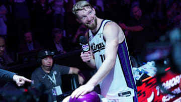 Apr 16, 2024; Sacramento, California, USA; Sacramento Kings forward Domantas Sabonis (10) lights the beam after the Kings defeated the Golden State Warriors during a play-in game of the 2024 NBA playoffs at the Golden 1 Center. Mandatory Credit: Cary Edmondson-Imagn Images