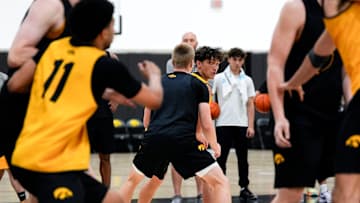 Iowa’s Isaia Howard (23) handles the ball as Bennett Stirtz (14) defends during practice June 19, 2025 at Carver-Hawkeye Arena in Iowa City, Iowa.