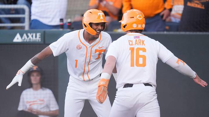 Tennessee's Blaine Brown (1) and Levi Clark (16) celebrate after scoring runs against Texas in an NCAA college baseball game in Knoxville, Tennessee on May 8, 2026.