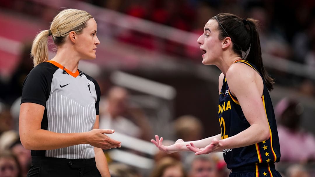 Indiana Fever guard Caitlin Clark (22) speaks with an official