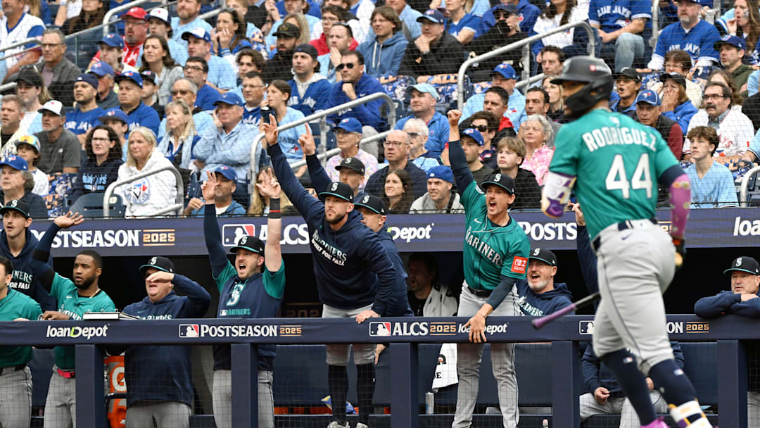 Oct 13, 2025; Toronto, Ontario, CAN; The Seattle Mariners bench reacts after a three run home run by center fielder Julio Rodriguez (44) in the first inning against the Toronto Blue Jays during game two of the ALCS round for the 2025 MLB playoffs at Rogers Centre. Mandatory Credit: Dan Hamilton-Imagn Images Oct 13, 2025; Toronto, Ontario, CAN; The Seattle Mariners bench reacts after a three run home run by center fielder Julio Rodriguez (44) in the first inning against the Toronto Blue Jays during game two of the ALCS round for the 2025 MLB playoffs at Rogers Centre. Mandatory Credit: Dan Hamilton-Imagn Images