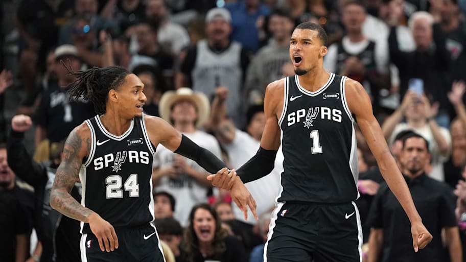 San Antonio Spurs forward Victor Wembanyama and guard Devin Vassell react during the first half of game five.