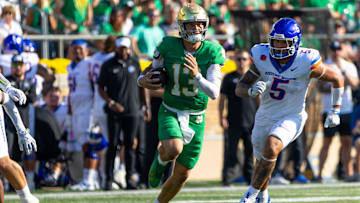 Oct 4, 2025; South Bend, Indiana, USA; Notre Dame Fighting Irish quarterback CJ Carr (13) runs the ball against the Boise State Broncos during the first half at Notre Dame Stadium. Mandatory Credit: Michael Caterina-Imagn Images