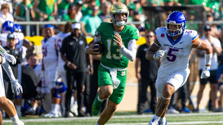 Oct 4, 2025; South Bend, Indiana, USA; Notre Dame Fighting Irish quarterback CJ Carr (13) runs the ball against the Boise State Broncos during the first half at Notre Dame Stadium. Mandatory Credit: Michael Caterina-Imagn Images
