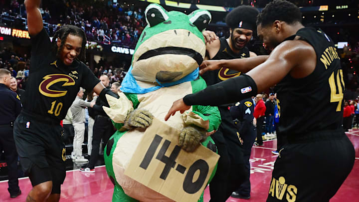 Mitchell, Garland, and Allen dance with the victory frog as the Cavaliers move to 14-0. Mitchell, Garland, and Allen dance with the victory frog as the Cavaliers move to 14-0.