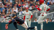 Jul 22, 2024; Minneapolis, Minnesota, USA; Minnesota Twins first baseman Carlos Santana (30) forces out Philadelphia Phillies shortstop Trea Turner (7) at first base for an out in the third inning at Target Field. Mandatory Credit: Jesse Johnson-USA TODAY Sports