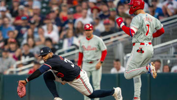 Jul 22, 2024; Minneapolis, Minnesota, USA; Minnesota Twins first baseman Carlos Santana (30) forces out Philadelphia Phillies shortstop Trea Turner (7) at first base for an out in the third inning at Target Field. Mandatory Credit: Jesse Johnson-USA TODAY Sports