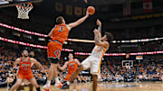 Dec 6, 2025; Nashville, Tennessee, USA;  Illinois Fighting Illini forward Ben Humrichous (3) blocks the shot of  Tennessee Volunteers guard Ja'Kobi Gillespie (0) during the first half at Bridgestone Arena. Mandatory Credit: Steve Roberts-Imagn Images