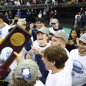 The Penn State Nittany Lions celebrate after winning the NCAA wrestling title at the T-Mobile Center in Kansas City.