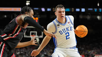 Apr 5, 2025; San Antonio, TX, USA; Duke Blue Devils forward Cooper Flagg (2) controls the ball against Houston Cougars forward J'Wan Roberts (13) during the second half in the semifinals of the men's Final Four of the 2025 NCAA Tournament at the Alamodome. Mandatory Credit: Bob Donnan-Imagn Images