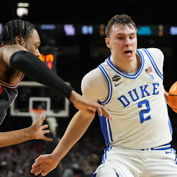 Apr 5, 2025; San Antonio, TX, USA; Duke Blue Devils forward Cooper Flagg (2) controls the ball against Houston Cougars forward J'Wan Roberts (13) during the second half in the semifinals of the men's Final Four of the 2025 NCAA Tournament at the Alamodome. Mandatory Credit: Bob Donnan-Imagn Images