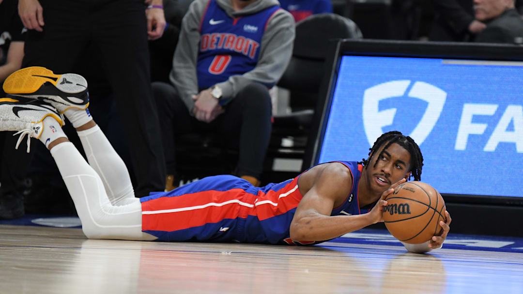 Jan 23, 2023; Detroit, Michigan, USA;  Detroit Pistons guard Jaden Ivy (23) saves a loose ball from going out of bounds against the  Milwaukee Bucks in the third quarter at Little Caesars Arena. Mandatory Credit: Lon Horwedel-Imagn Images