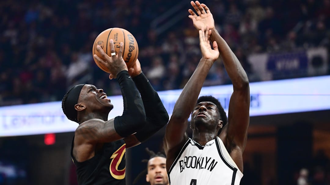 Feb 19, 2026; Cleveland, Ohio, USA; Cleveland Cavaliers guard Dennis Schroder (8) drives to the basket against Brooklyn Nets guard Drake Powell (4) during the second half at Rocket Arena. Mandatory Credit: Ken Blaze-Imagn Images