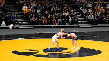 Iowa’s Michael Caliendo wrestles Illinois’ Braeden Scoles in a 165-pound match Friday, Jan. 17, 2025 at Carver-Hawkeye Arena in Iowa City, Iowa.