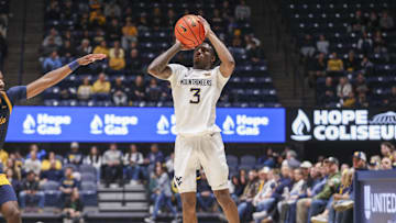 Dec 3, 2025; Morgantown, West Virginia, USA; West Virginia Mountaineers guard Honor Huff (3) shoots a three pointer during the second half against the Coppin State Eagles at Hope Coliseum. Mandatory Credit: Ben Queen-Imagn Images