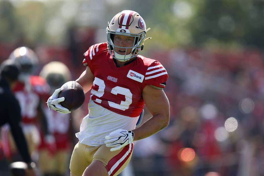 Christian McCaffrey holds a ball during training camp.