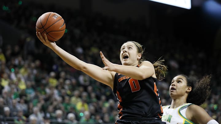 Jan 24, 2020; Eugene, Oregon, USA; Oregon State Beavers guard Mikayla Pivec (0) shoots the ball against Oregon Ducks forward Satou Sabally during the first half at Matthew Knight Arena. Mandatory Credit: Soobum Im-Imagn Images