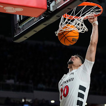 Cincinnati Bearcats guard Shon Abaev (10) dunks in the first half of the NCAA Men’s Basketball game between the Cincinnati Bearcats and the Dayton Flyers at Fifth Third Arena in Cincinnati on Tuesday, Nov. 11, 2025.