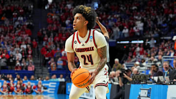 Mar 20, 2025; Lexington, KY, USA; Louisville Cardinals guard Chucky Hepburn (24) shoots the ball during the first half against the Creighton Bluejays in the first round of the NCAA Tournament at Rupp Arena. Mandatory Credit: Aaron Doster-Imagn Images