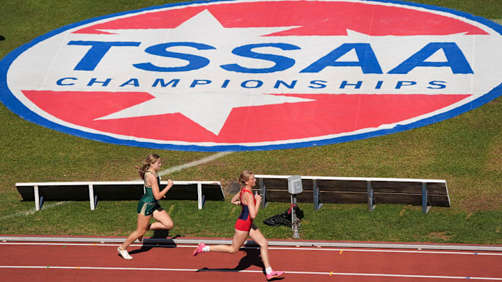 St. Benedict-Auburndale and Briarcrest runs past the TSSAA logo during a mixed 4 x 400 meter Relay at the TSSAA high school track and field championship at MTSU on May 21, 2025, in Murfreesboro, Tenn.