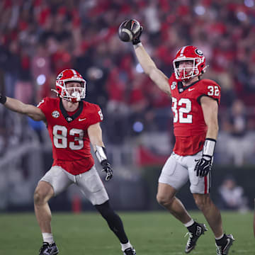 Nov 15, 2025; Athens, Georgia, USA; Georgia Bulldogs running back Cash Jones (32) and teammates celebrate during the second half against the Texas Longhorns at Sanford Stadium. Mandatory Credit: Brett Davis-Imagn Images