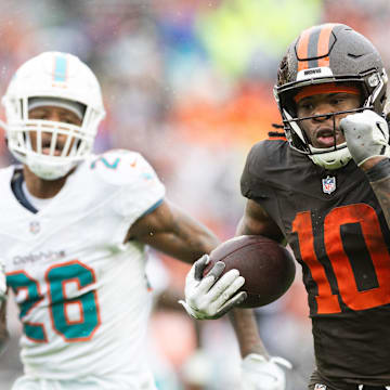 Oct 19, 2025; Cleveland, Ohio, USA; Cleveland Browns running back Quinshon Judkins (10) runs the ball for a touchdown against Miami Dolphins cornerback Rasul Douglas (26) during the second quarter at Huntington Bank Field. Mandatory Credit: Scott Galvin-Imagn Images