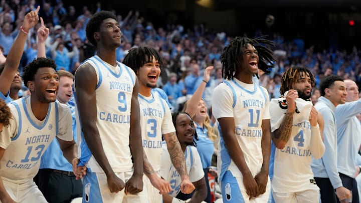 Feb 19, 2025; Chapel Hill, North Carolina, USA; North Carolina Tar Heels forward Jalen Washington (13), guard Drake Powell (9), guard Elliot Cadeau (3), guard Ian Jackson (11), and guard RJ Davis (4) celebrate in the second half at Dean E. Smith Center. Mandatory Credit: Bob Donnan-Imagn Images