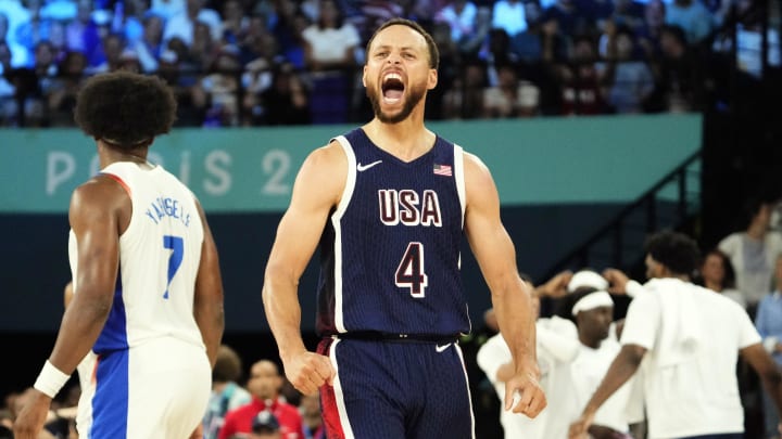 Aug 10, 2024; Paris, France; United States shooting guard Stephen Curry (4) celebrates in the second half against France in the men's basketball gold medal game during the Paris 2024 Olympic Summer Games at Accor Arena. Mandatory Credit: Rob Schumacher-USA TODAY Sports