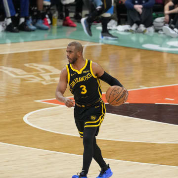 Mar 31, 2024; San Antonio, Texas, USA;  Golden State Warriors guard Chris Paul (3) dribbles in front of San Antonio Spurs guard Blake Wesley (14) in the first half at Frost Bank Center. Mandatory Credit: Daniel Dunn-USA TODAY Sports