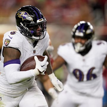 Dec 25, 2023; Santa Clara, California, USA; Baltimore Ravens linebacker Patrick Queen (6) runs with the ball after intercepting a pass against the San Francisco 49ers in the third quarter at Levi's Stadium. Mandatory Credit: Cary Edmondson-Imagn Images