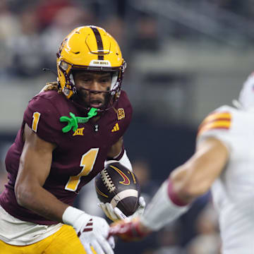 Dec 7, 2024; Arlington, TX, USA; Arizona State Sun Devils defensive back Keith Abney II (1) runs with the ball after intercepting a pass against the Iowa State Cyclones in the third quarter at AT&T Stadium. Mandatory Credit: Tim Heitman-Imagn Images