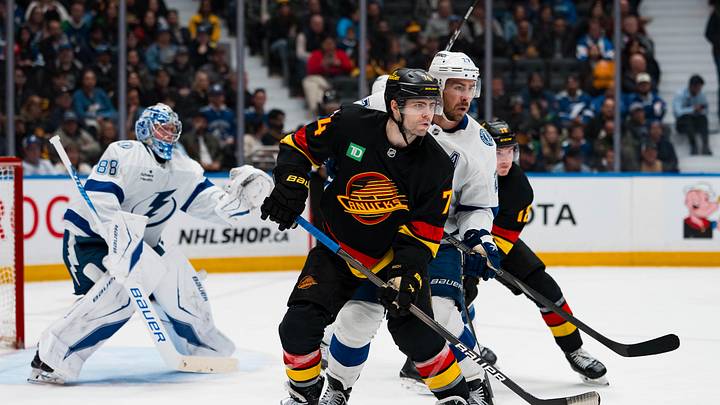 Mar 19, 2026; Vancouver, British Columbia, CAN; Tampa Bay Lightning defenseman Ryan McDonagh (27) battles with Vancouver Canucks forward Jake DeBrusk (74) in the second period at Rogers Arena. Mandatory Credit: Bob Frid-Imagn Images