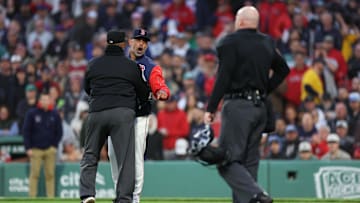 May 20, 2025; Boston, Massachusetts, USA; Boston Red Sox manager Alex Cora (13) yells at home plate umpire Mike Estabrook (83) during the third inning against the New York Mets at Fenway Park. Mandatory Credit: Paul Rutherford-Imagn Images