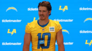 Jul 24, 2024; El Segundo, CA, USA;  Los Angeles Chargers quarterback Justin Herbert (10) speaks to the media after the first day of training camp at The Bolt. Mandatory Credit: Kiyoshi Mio-USA TODAY Sports