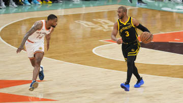 Mar 31, 2024; San Antonio, Texas, USA; Golden State Warriors guard Chris Paul (3) dribbles in front of San Antonio Spurs guard Blake Wesley (14) in the first half at Frost Bank Center. 