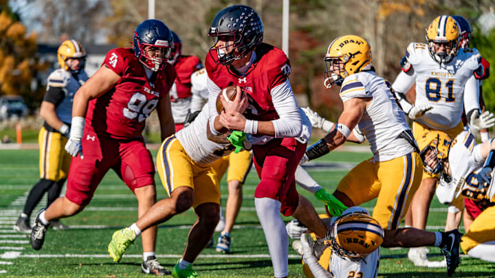 Tabor Academy's quarterback Peter Bourque runs in a touchdown on the opening drive against the BB&N Knights . JOSH SOUZA/STANDARD-TIMES SPECIAL