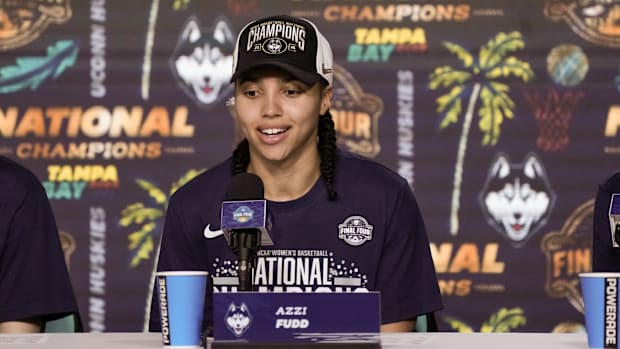 Azzi Fudd (35) speaks to the media