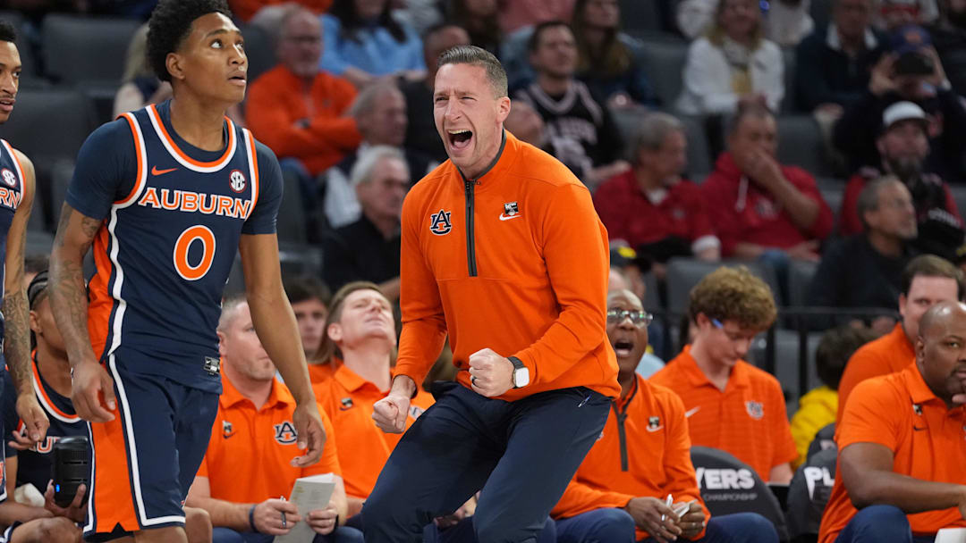 Auburn Tigers head coach Steven Pearl celebrated the play of guard Tahaad Pettiford who had 24 points in the win over Oregon.