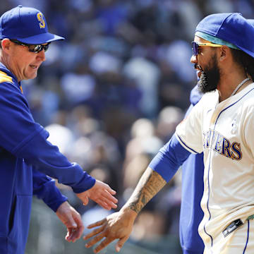 Seattle Mariners shortstop J.P. Crawford (right) celebrates with manager Dan Wilson after a win against the Cleveland Guardians on June 15 at T-Mobile Park.