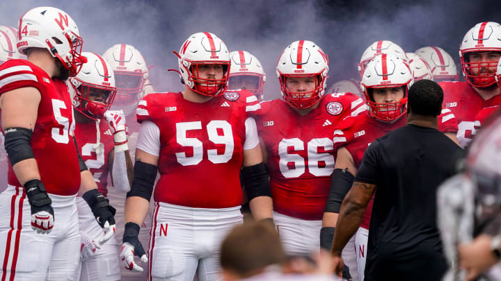 Sep 23, 2023; Lincoln, Nebraska, USA; Nebraska Cornhuskers offensive lineman Bryce Benhart (54), offensive lineman Henry Lutovsky (59), Nebraska Cornhuskers offensive lineman Ben Scott (66) and teammates before the game against the Louisiana Tech Bulldogs at Memorial Stadium.