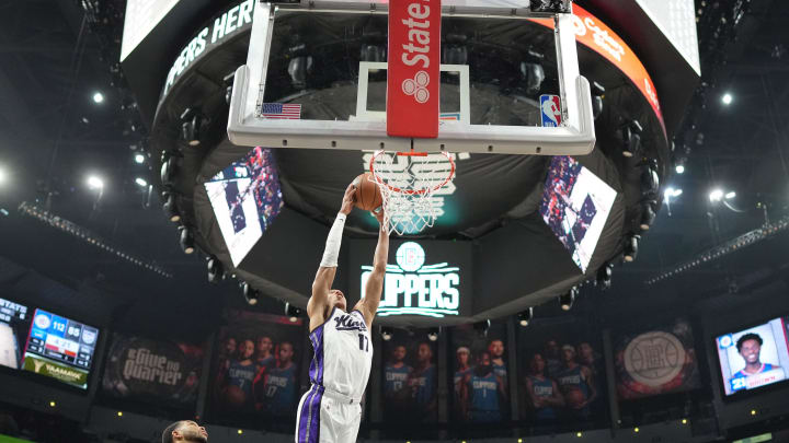 Dec 6, 2023; Los Angeles, California, USA; Sacramento Kings forward Kessler Edwards (17) dunks the ball against the LA Clippers in the second half at Crypto.com Arena. Mandatory Credit: Kirby Lee-USA TODAY Sports